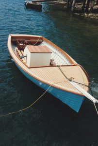 Image of timber electric boat on the water