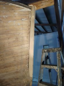 Image of a wooden boat being restored